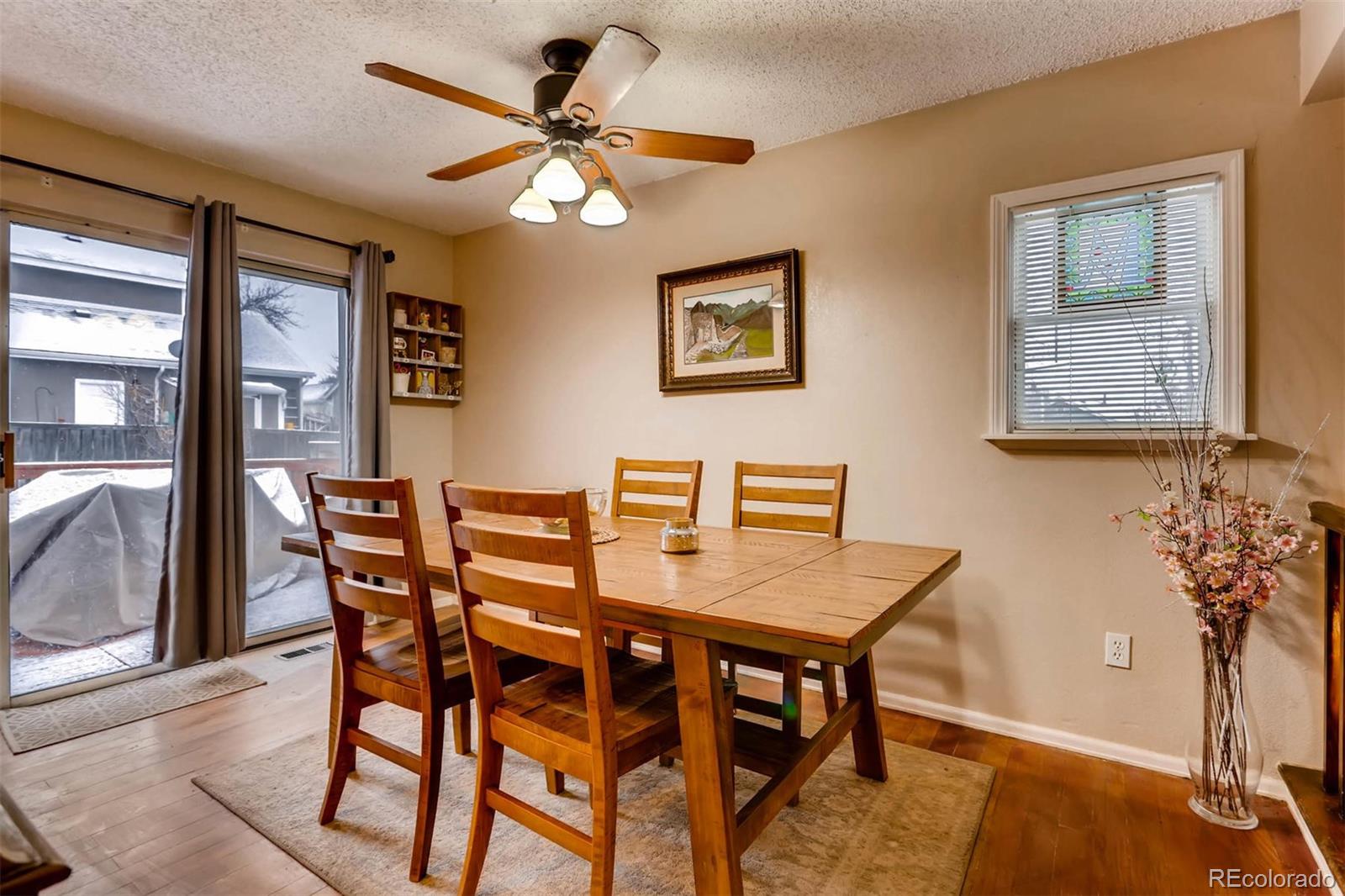 696 Myrtlewood Court Highlands Ranch, CO 80126 - Photo 6 of 12 a view of a dining room with furniture and a chandelier