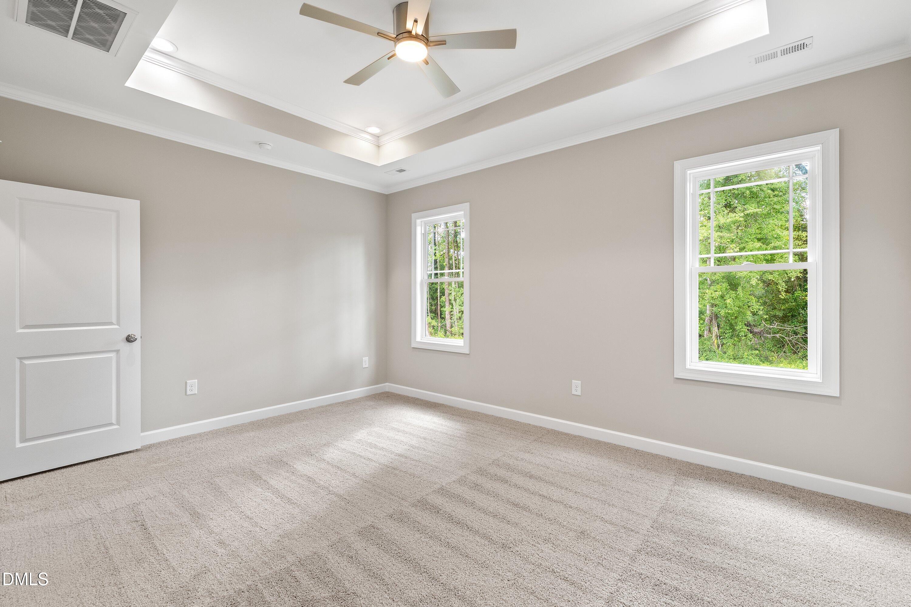 1115 Nor-Am Road Pikeville, NC 27863 - Photo 28 of 40 an empty room with windows and fan
