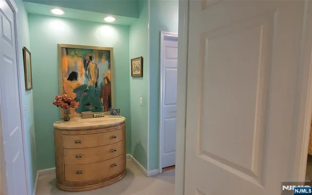 a living room with furniture and large windows