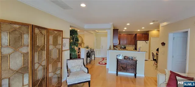 a view of living room with furniture and flower pot