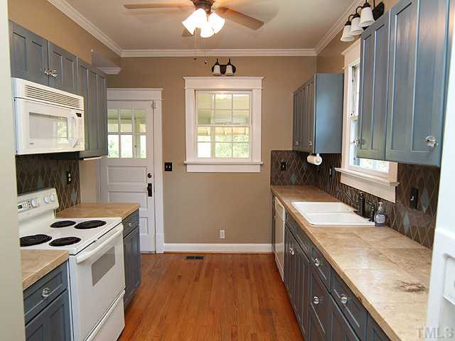 227 Glascock Street Raleigh, NC 27604 - Photo 6 of 17 Galley kitchen with door to back screened porch Kitchen