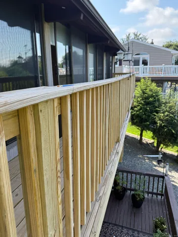 a view of a balcony with wooden floor