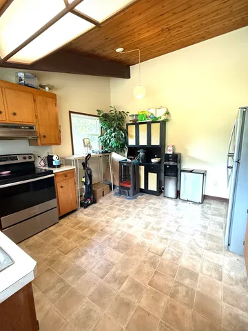 a kitchen with lots of counter top space and appliances