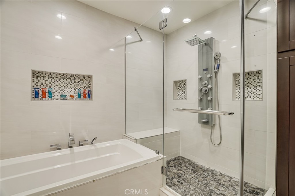 49 East Yale Loop, Unit 26 Irvine, CA 92604 - Photo 41 of 63 a bathroom with a bathtub and a shower