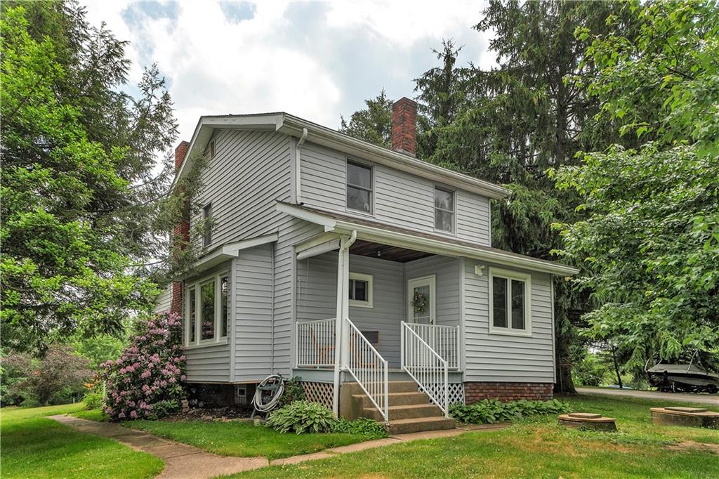 Wonderful covered porch on this back entry.
