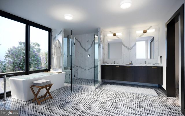 a bathroom with a sink a toilet and large mirror