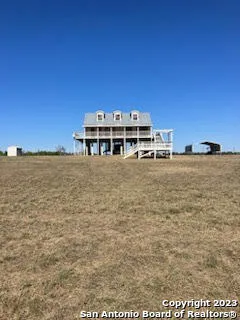 a view of a big room with large trees
