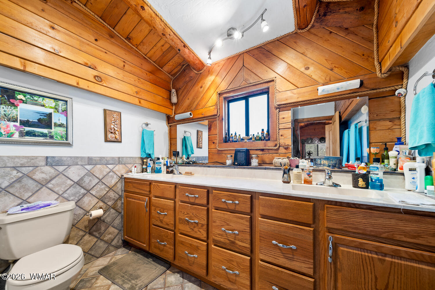6720 Cheney Ranch Loop Show Low, AZ 85901 - Photo 43 of 55 a spacious bathroom with a double vanity sink toilet mirror and bathtub