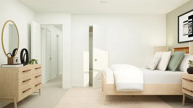 a spacious bedroom with a bed and a window