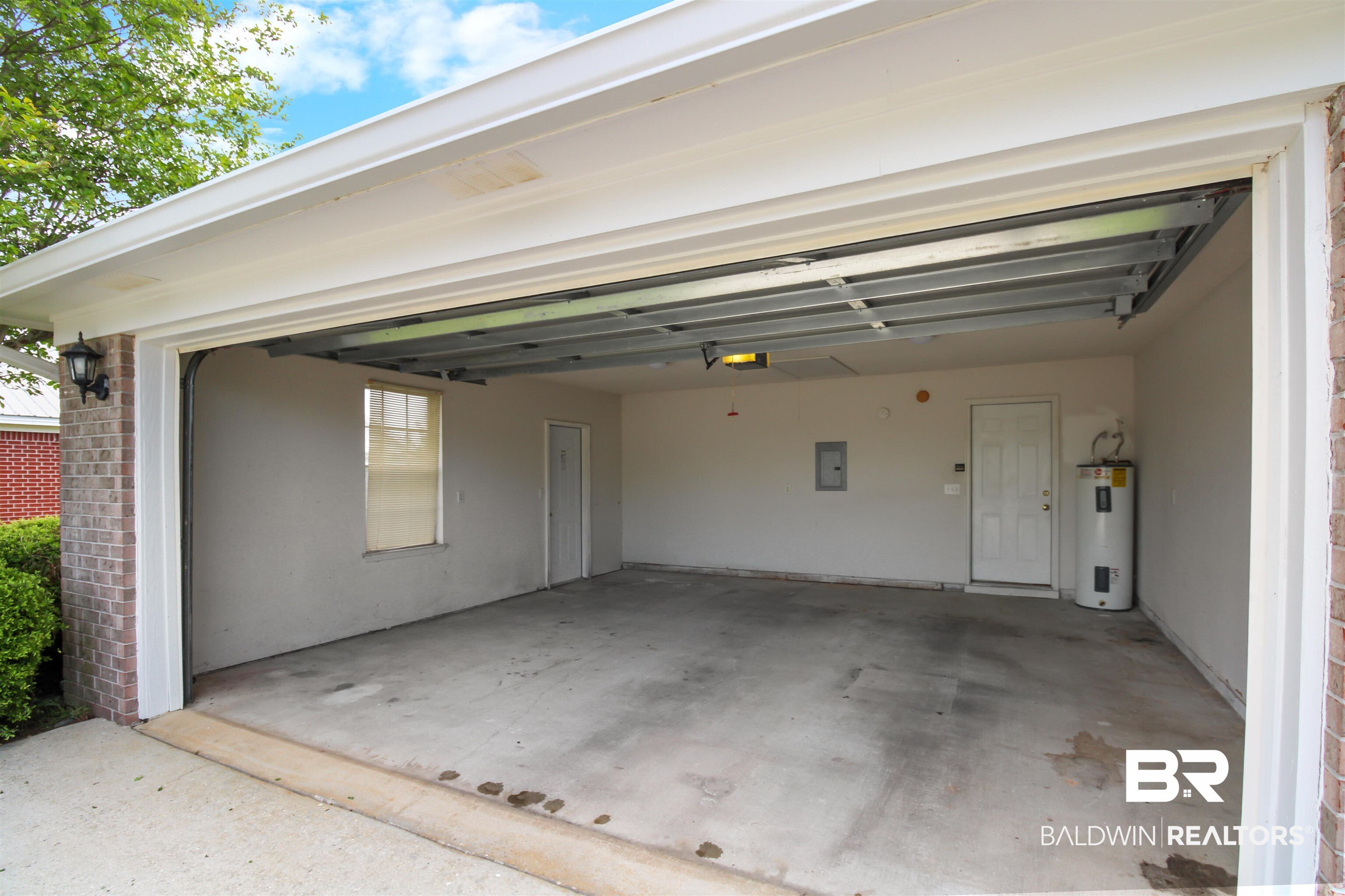 8940 Caitlin Street Foley, AL 36535 - Photo 27 of 27 Garage with electric water heater and electric panel