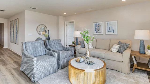 a living room with furniture and a table