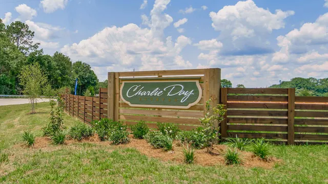 a view of a sign board with yard