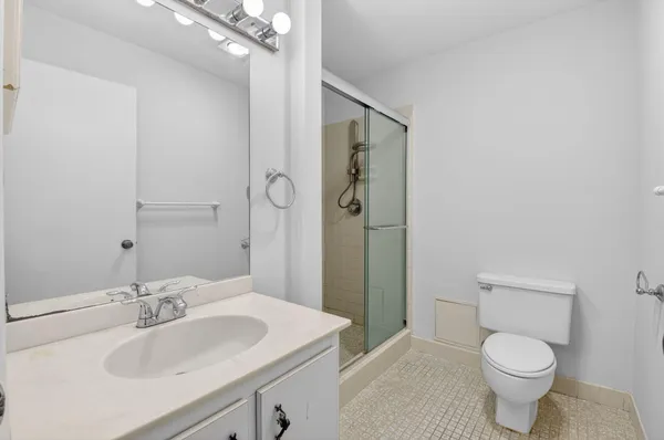 a view of a lake with houses in the back