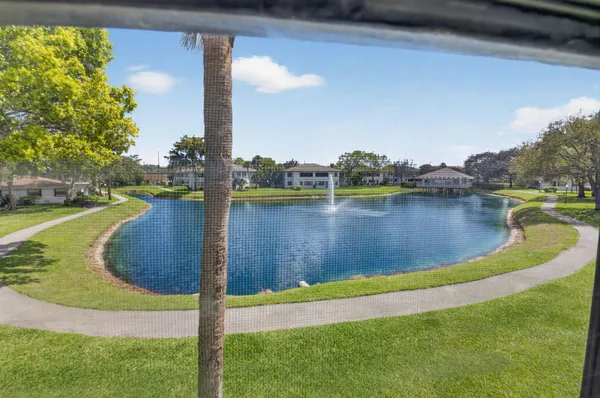 an aerial view of a house with a lake view