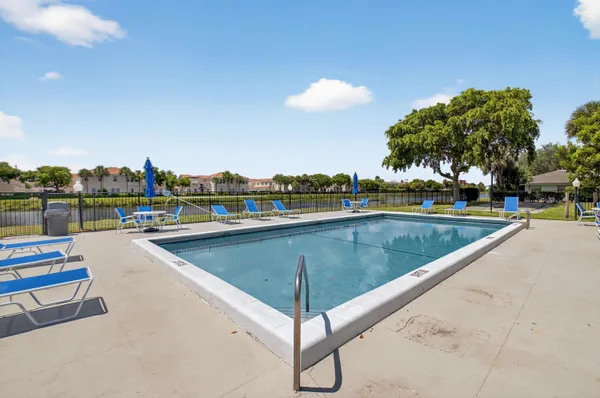 an aerial view of a house with a yard table and chairs