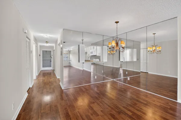 a view of a living room with wooden floor
