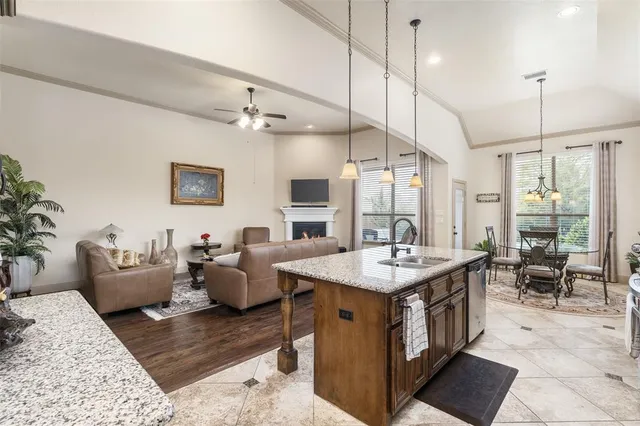 a living room with furniture a table and chairs