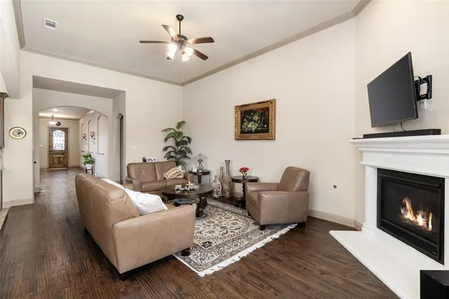 a bed sitting in a spacious bedroom next to a window