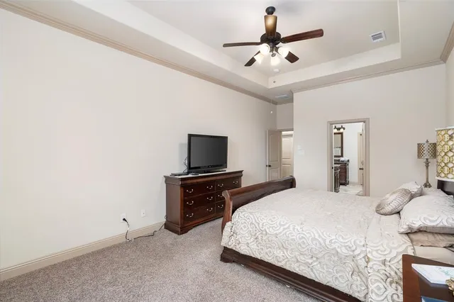 a bathroom with a granite countertop sink a stove and a mirror