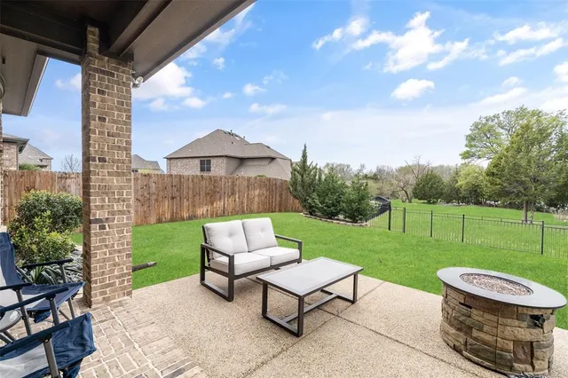 a view of a patio with a yard
