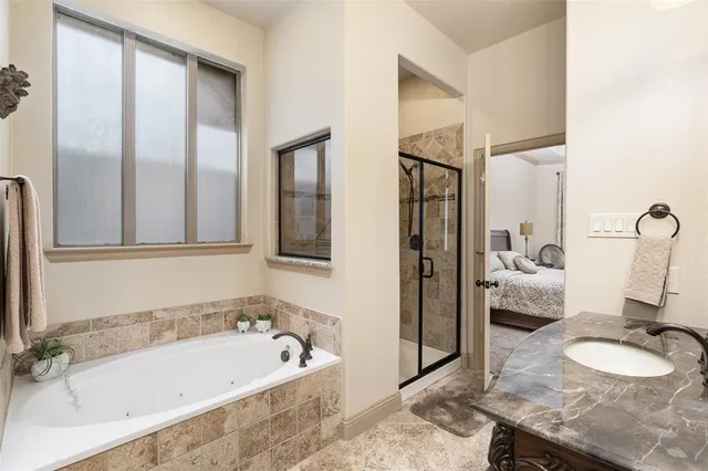 a view of a livingroom with furniture and a flat screen tv