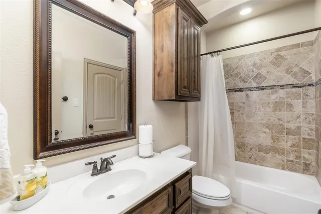 a bathroom with a sink vanity and mirror