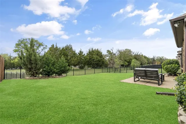 a view of a backyard with sitting area