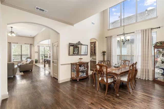 a view of a dining room with furniture and wooden floor