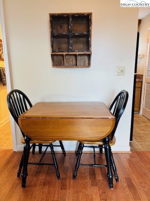 301 Pinnacle Inn Road, Unit 4301 Beech Mountain, NC 28604 - Photo 3 of 9 a view of a dining room with furniture and wooden floor