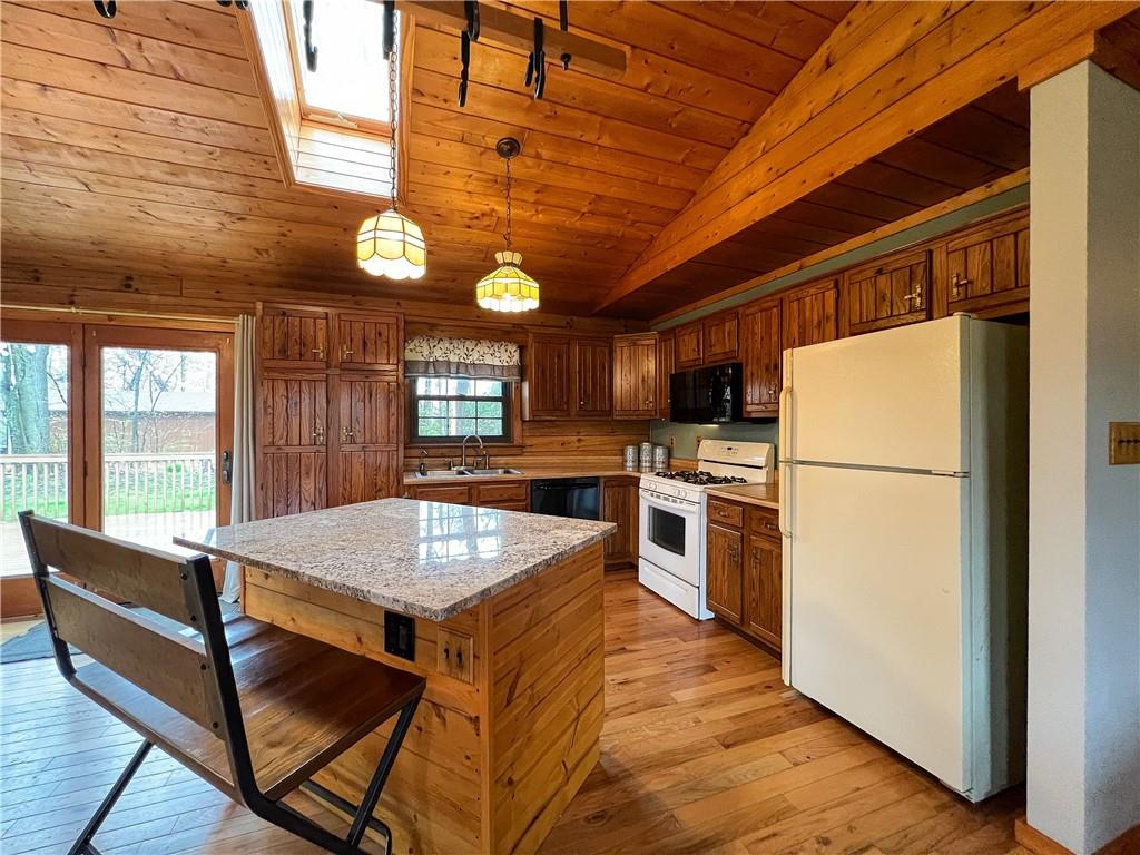 110 Zetta Lane Butler, PA 16002 - Photo 12 of 36 a kitchen with refrigerator cabinets and wooden floor