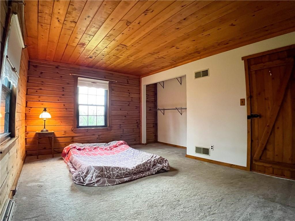 110 Zetta Lane Butler, PA 16002 - Photo 14 of 36 a bedroom with a bed and wooden floor