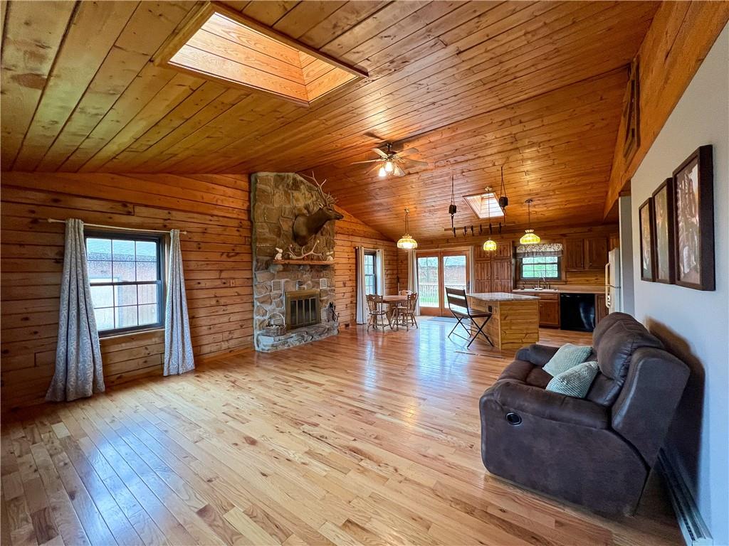 110 Zetta Lane Butler, PA 16002 - Photo 2 of 36 a living room with fireplace furniture and a wooden floor
