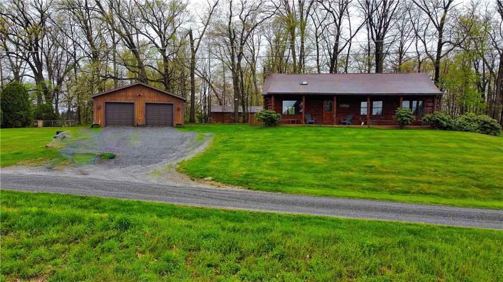 110 Zetta Lane Butler, PA 16002 - Photo 36 of 36 a front view of a house with a garden and trees