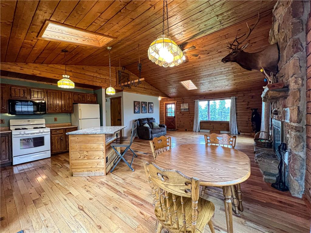 110 Zetta Lane Butler, PA 16002 - Photo 10 of 36 a view of a dining room with furniture a kitchen wooden floor and chandelier