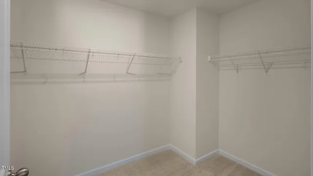 a view of an empty walk in closet