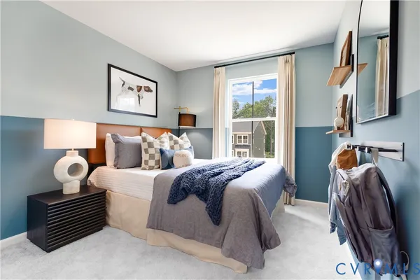 a bedroom with bed and a window