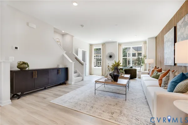 a living room with furniture and a rug