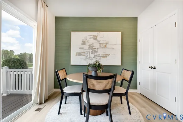 a view of a chairs and table in a balcony