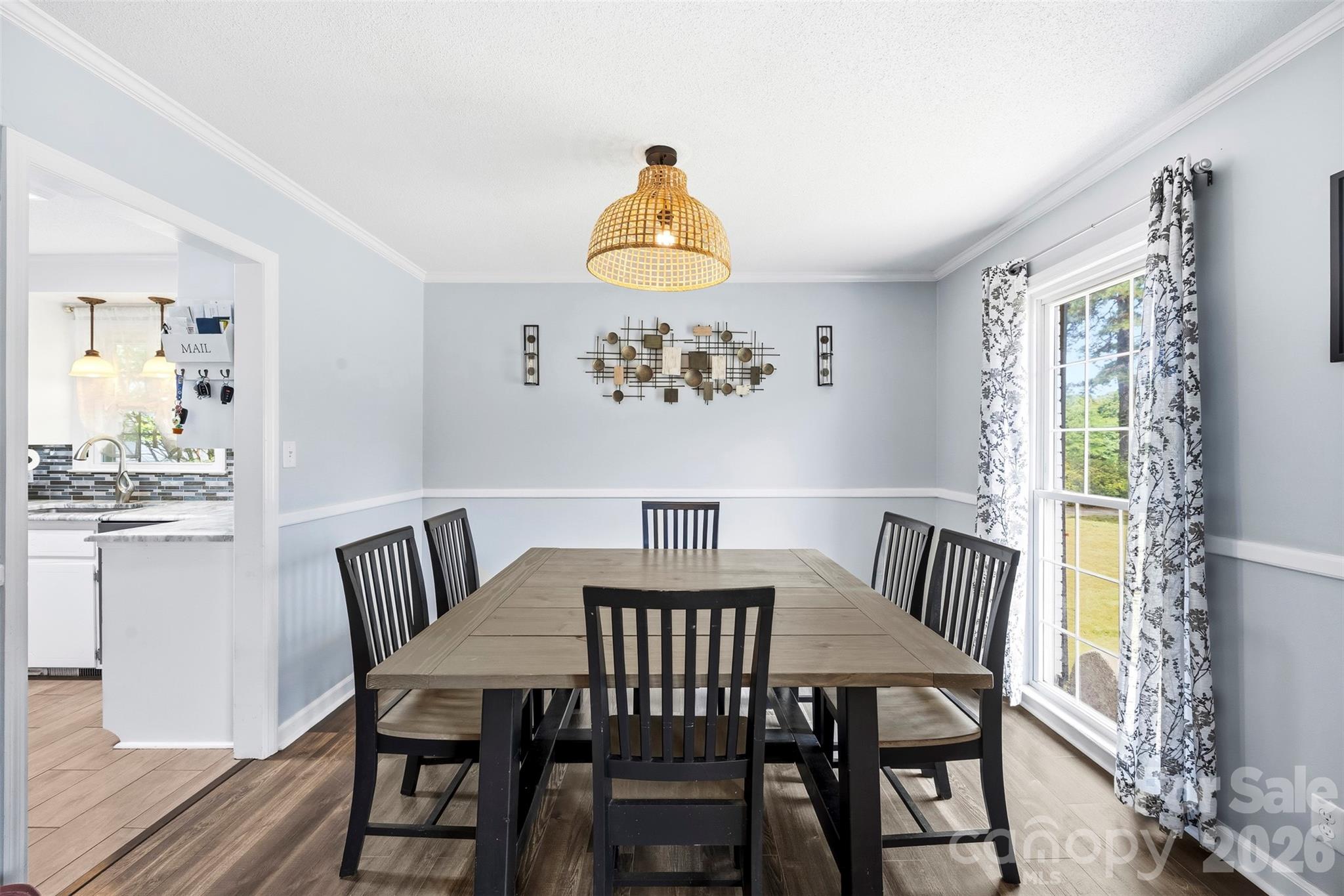 10919 Harrisburg Road Fort Mill, SC 29707 - Photo 9 of 43 a view of a dining room with furniture window and wooden floor