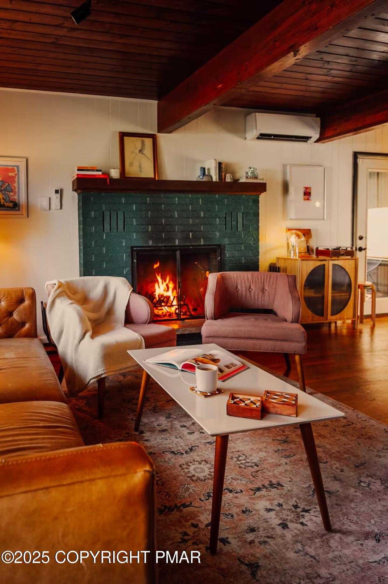 1242 Shadblow Road Pocono Summit, PA 18346 - Photo 12 of 46 a living room with furniture a rug and a fireplace