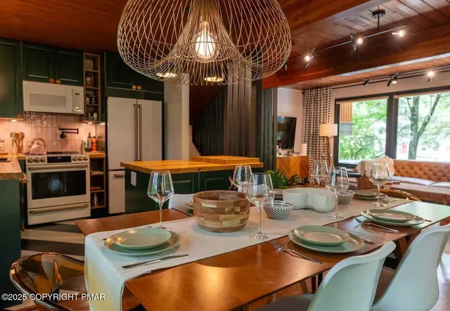 a kitchen with a table chairs and a stove