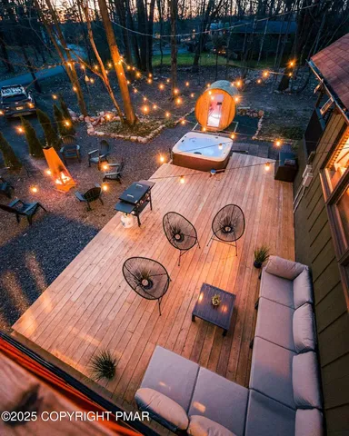 a backyard of a house with table and chairs