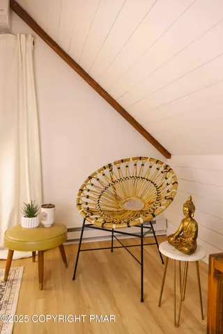 a view of a chairs and table in a balcony