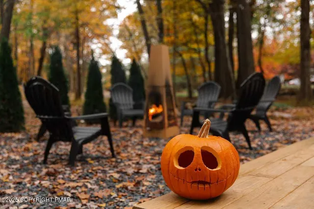 a view of an chairs and table in the patio