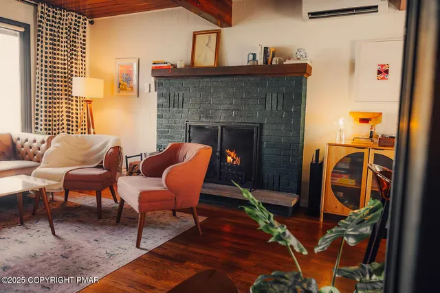 a balcony with furniture and a fireplace