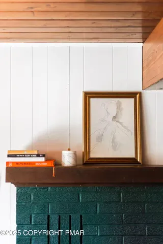 a floor to ceiling window and a rug