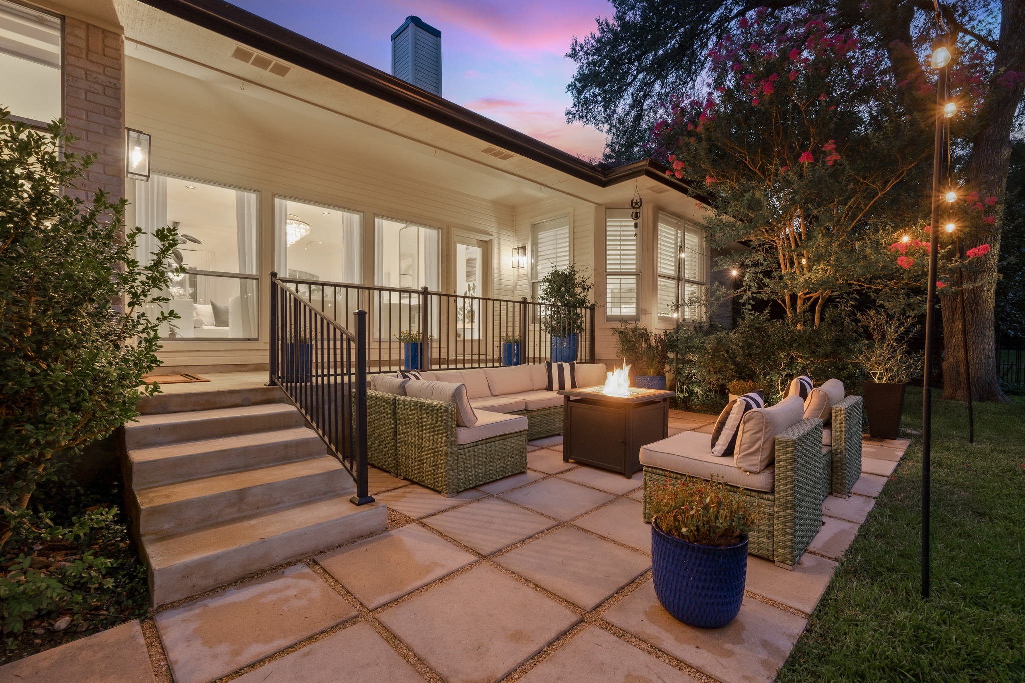 30115 Sawgrass Trail Georgetown, TX 78628 - Photo 22 of 37 An inviting outdoor living space features a cozy fire pit and ample seating on a paver patio.