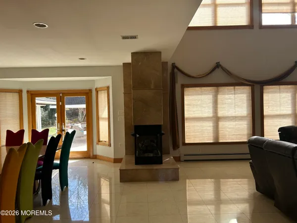 a living room with furniture and a rug