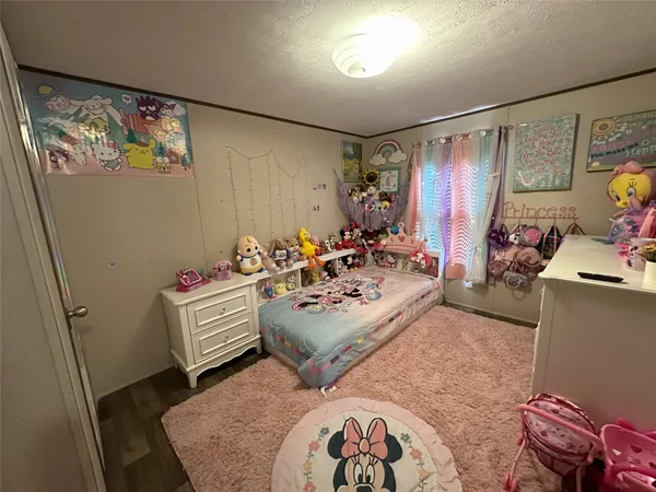 a view of a livingroom with furniture and a workspace