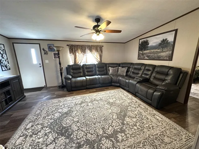 a living room with furniture and a window
